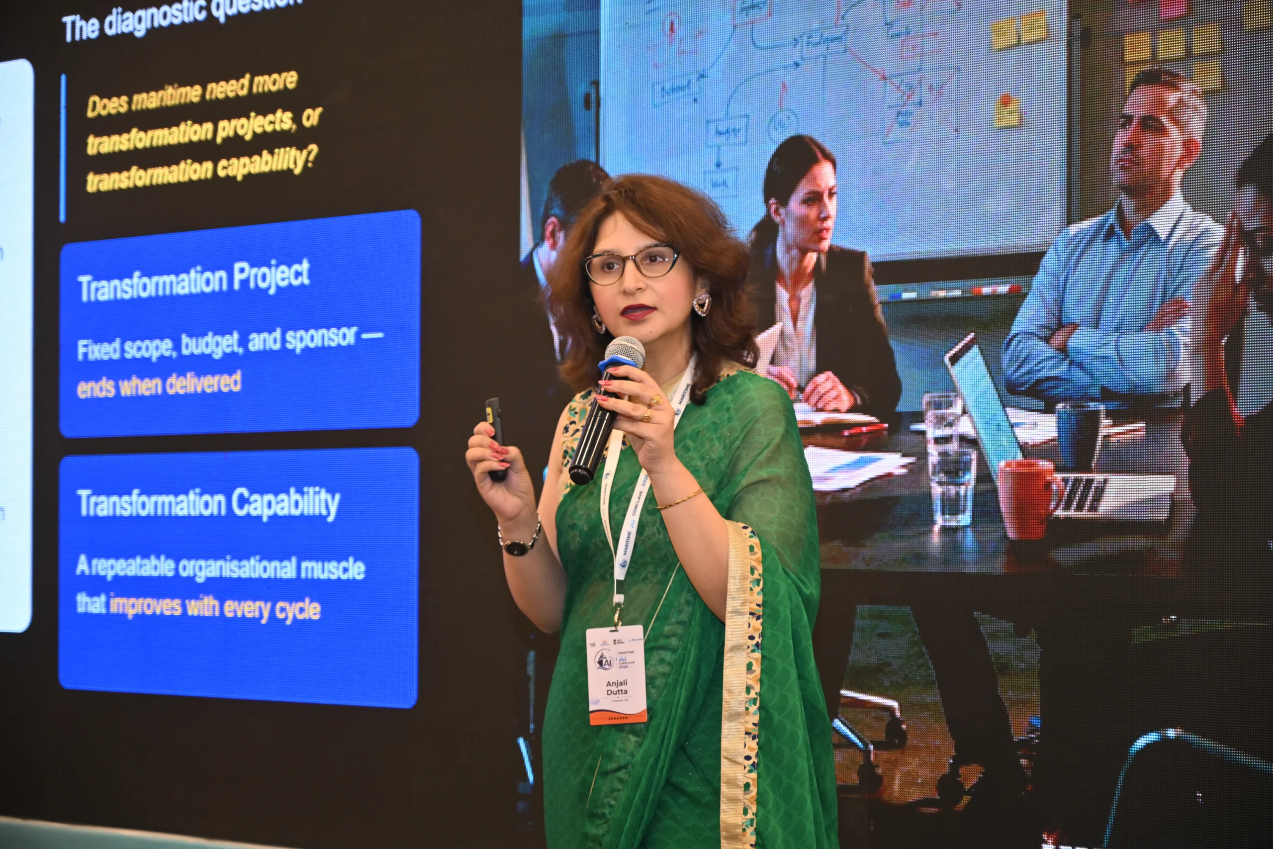 Anjali Dutta speaking on stage about transformation