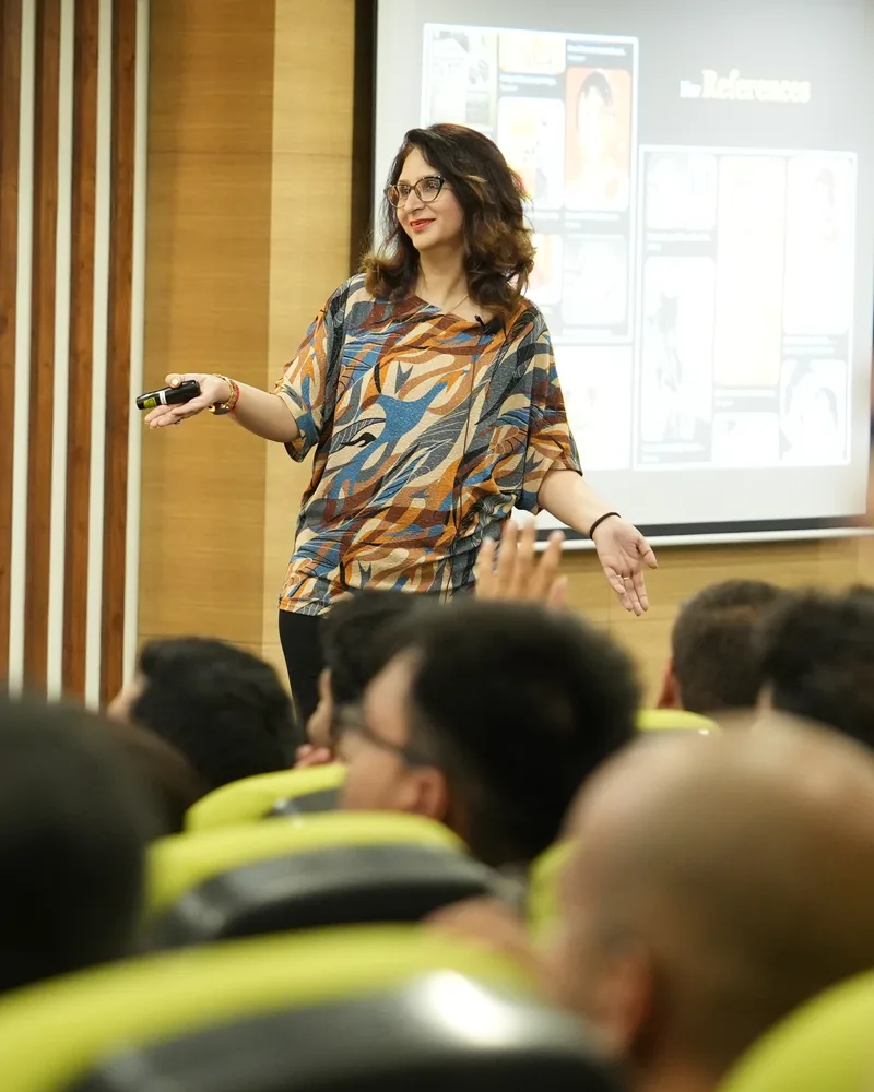 Anjali Dutta giving a guest lecture to a full auditorium